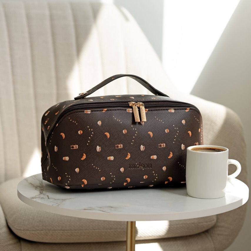 Brown toiletry bag with gold accents 